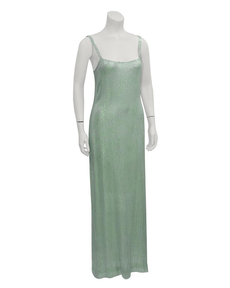 Halston Mint Green Sequin Gown & Bolero: This stunning 1970s Halston gown is mint green silk chiffon covered entirely with iridescent mint sequins. Gown has a sheath silhouette, with a camisole neckline. Fully lined in chiffon. Matching bole