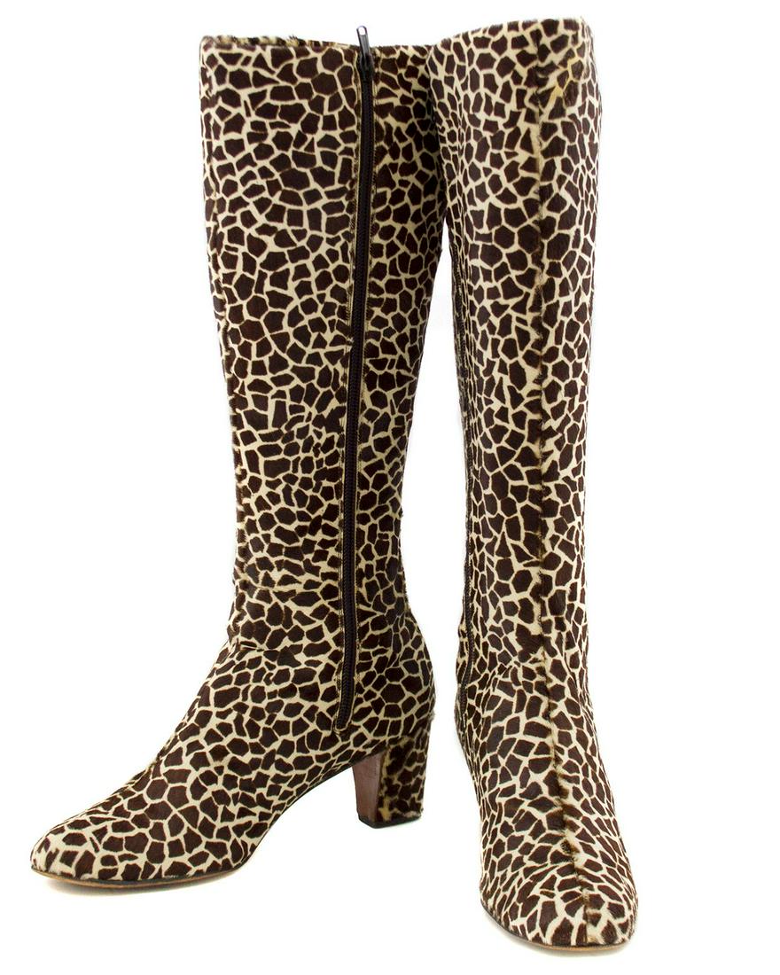 Saks Fifth Avenue Giraffe Printed Pony Hair Knee High: Saks 5th Avenue label pony hair night heel boots from the 1970s. The giraffe printed pony hair covers the entire exterior of the boot from top to toe and even the heel. The interior is lined in black 