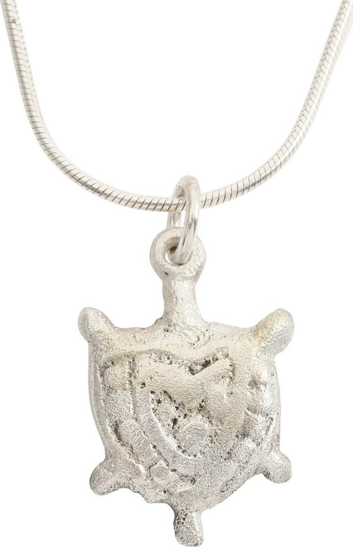 VIKING HEART PENDANT C.900 AD.: Early example of the fully evolved form. Raised border with projecting quartered nubs. The cusped top heart formed by a border surrounding a second heart flanked by beaded bands. Made by the open face