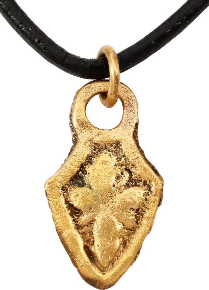 GOTHIC EUROPEAN NECKLACE PENDANT: C. 12th-15th century. Gold on bronze, shield shaped with raised rounded edge and foliate representation of the cross with radiants at the inside angles. Transitional from the classic Viking heart pend
