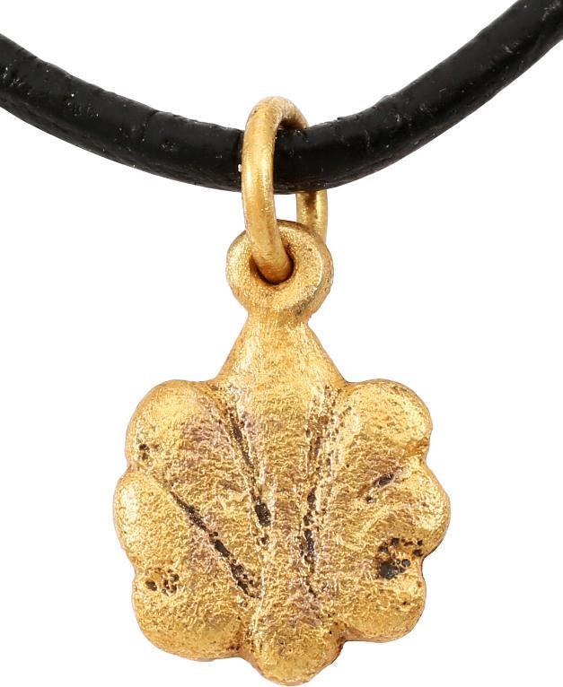 ANCIENT ROMAN SHELL NECKLACE PENDANT C.100-400 A.D.: Gold over bronze. Just under 5/8” height. Symmetrical radial ribbed form, a floral like representation of a sea shell. Romans were very dependent on the sea and used sea motifs, real and mythical ex