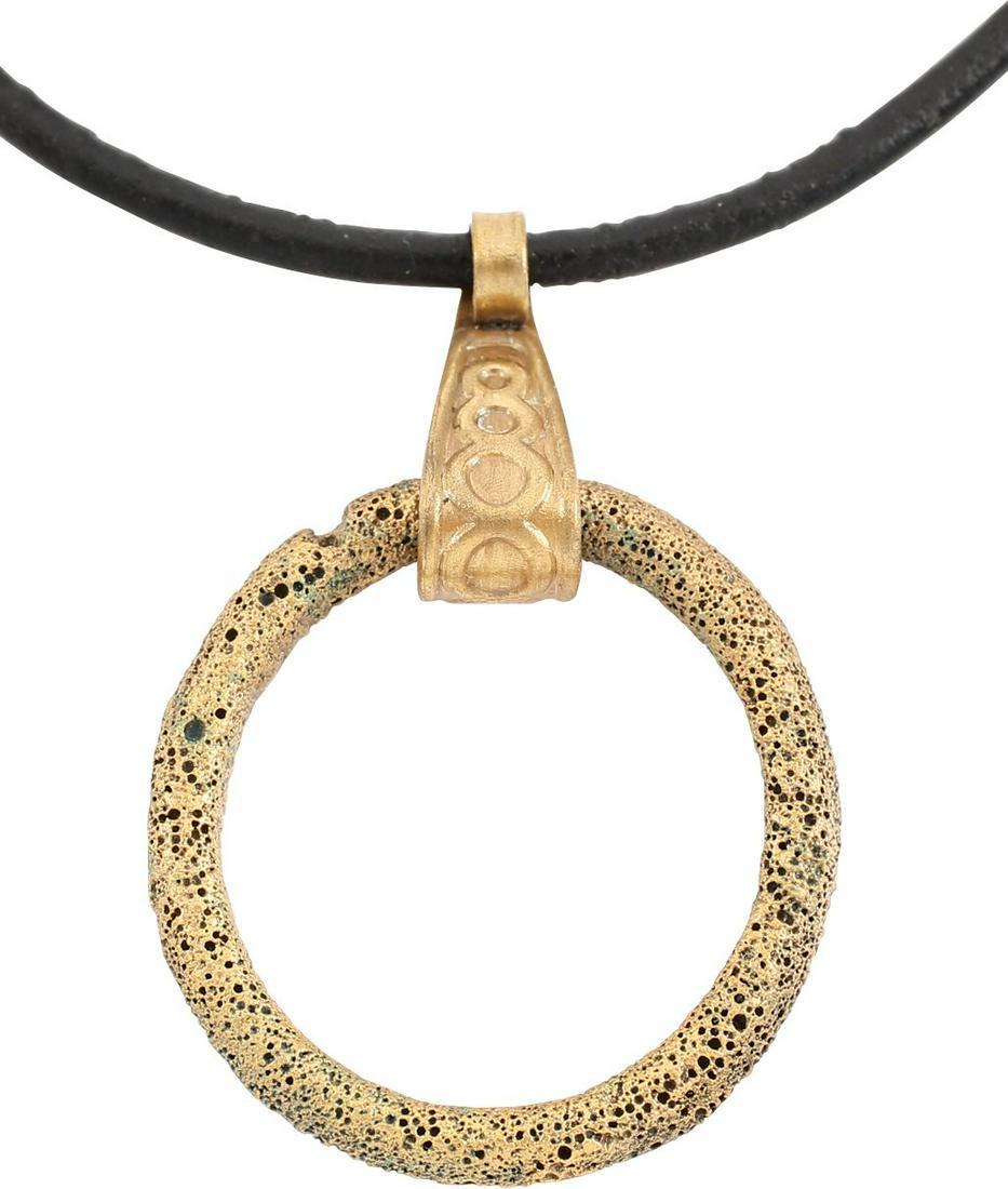 VIKING PROTECTIVE BROOCH PENDANT 10th CENTURY: Circular bronze, just over 1Â” diameter with rounded front and flat back forming a ridged edge. The surface textured from burial. Professionally conserved and the s4karat gold surface restored. On 