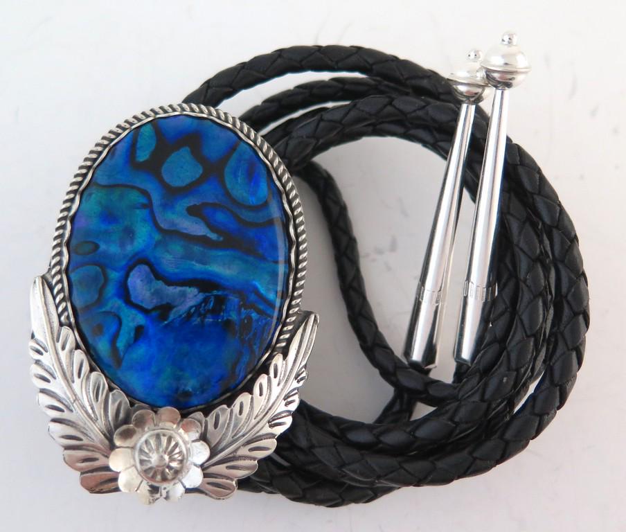 Sterling Silver with Blue Abalone Handmade Bolo Tie: Title: Sterling Silver with Blue Abalone Handmade Bolo Tie Date/Period: 2020 Materials: Sterling Silver Dimensions: It measures 2 & 1/8" (5.4 cm) long and 1.5" wide (3.81 cm) Additional Information: T