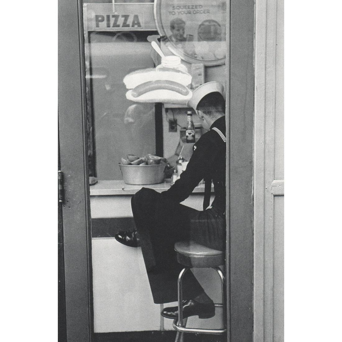 LOUIS STETTNER - Sailor in Times Square, 1955: Artist: LOUIS STETTNER Print Title: Sailor in Times Square, 1955 Medium: Sheet-fed Gravure Printing Date: 1970's Printed: Switzerland Image Size: 10 X 6.75 inches Louis Stettner (1922-2016) was an Ame