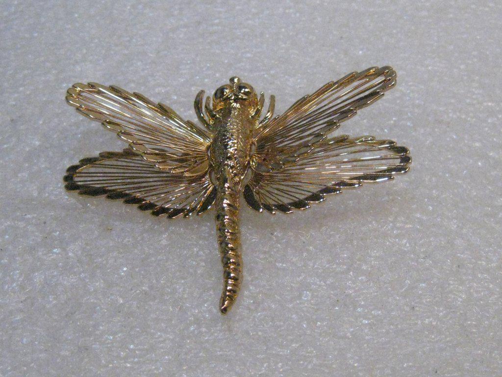Vintage Monet Dragonfly Brooch, Wired Gold Tone,: Vintage Monet Dragonfly Brooch, Wired Wings. 1.75" long and 2-3/8" wide with tiered wired wings. Signed Monet, 1960's. Looks new. Very good condition. Great for weddings too.. something old and new an