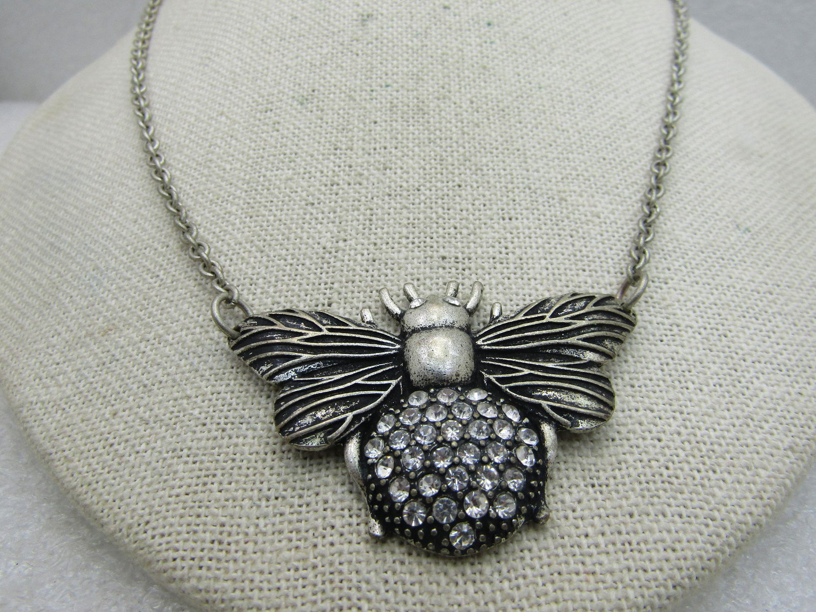 Vintage Rhinestone Bee Necklace, 30", Silver Tone,: Vintage Rhinestone Bee Necklace, 30", Silver Tone. This has a 2" wide and 1.5" tall bee with pave set rhinestones and black wash on his back end and rhinestone eys. The chain is 30" and attached at ea