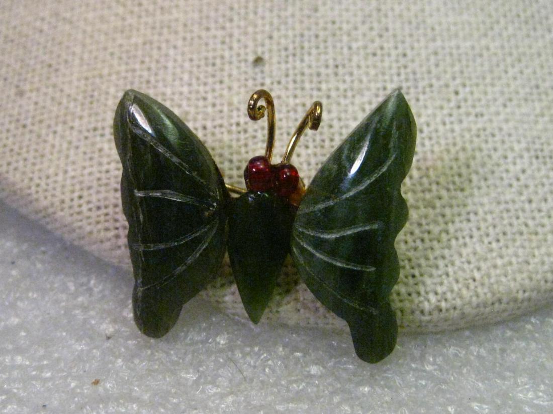 Lot of 8 Carved Jade-like Carved Butterfly Brooches: Vintage Lot of 6 Gold tone Carved Jade-like Butterfly Brooches - Asian theme - appx. 1980's - gold tone pin back and antenna. This appears to be real stone - jade, jadeite, nephrite or possibly serpen