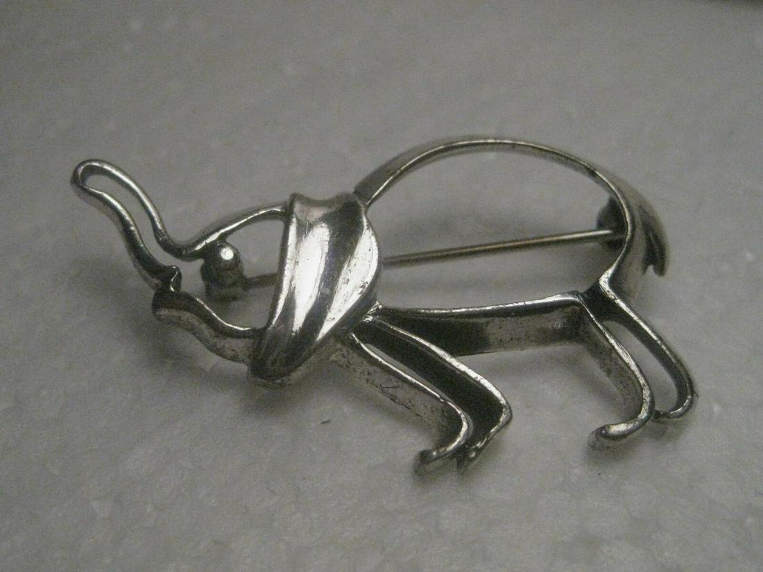 Vintage Sterling Silver Elephant Brooch by Beau,: Vintage, very nice, Beau signed Elephant Brooch - Sterling Silver, 5.50 grams. It is nearly 1.75" wide and 1" from top of trunk to toe. It is an outline style brooch. It does have some vintage patina/