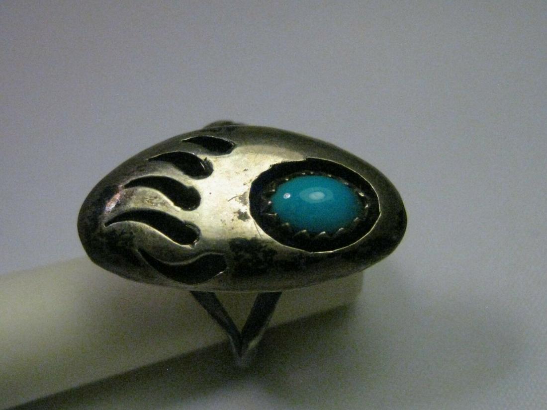 Vintage Sterling Silver Turquoise Bear Paw Ring, Sz.: Vintage appx. 1970's sterling silver Southwestern pear paw designed ring with sawtooth oval turquoise stone that is about 1/2" wide. Shadow box effect on the stone and the claws are deeply etched into