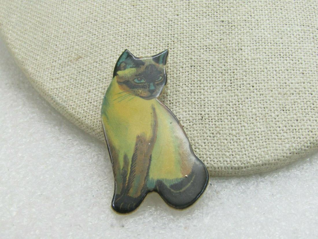 Vintage Siamese Cat, Glazed Art Paper, Signed,: Vintage Siamese Cat Brooch, stiff art paper with a blazed finish and a water-color lie Siamese Cat. 2" tall and about 7/8" wide at the widest point. It is signed with what looks like Louise but may no
