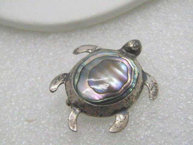 Vintage Sterling Abalone Turtle Brooch, Taxco Mexico,: Vintage Sterling Abalone Turtle Brooch, Taxco, Mexico, signed ARH and T8-31 or TB-31. Weight is 3.52 grams. It is 1.25" from nose to tail and 1" wide. The abalone is inlaid in a bezel framed shell. Ag