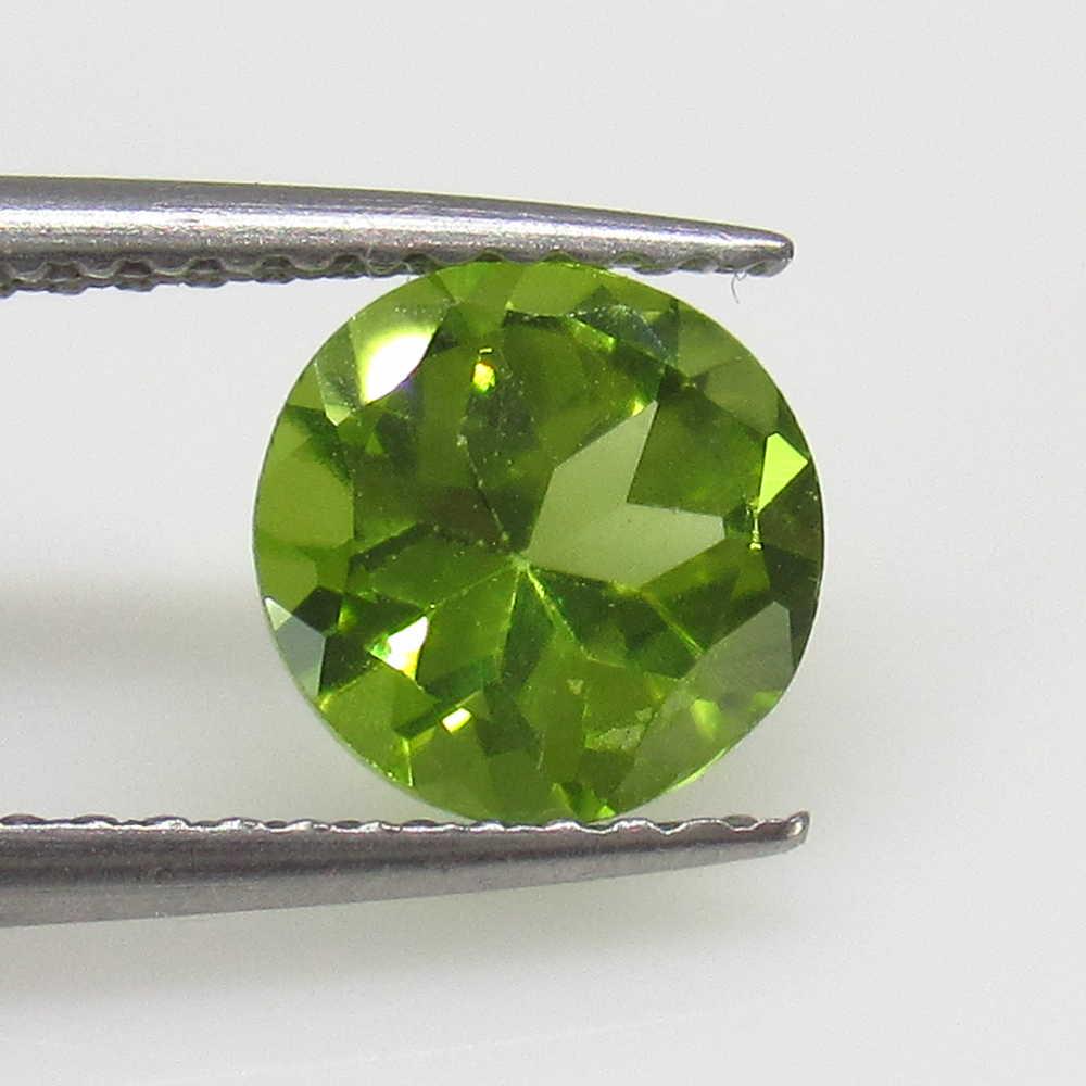 1.26 Ctw Natural Pakistan Peridot Round Cut: No Reserve! Title: 1.26 Ctw Natural Pakistan Peridot Round Cut Stone Clarity: VVS Gemstones: Peridot Carat Weights: 1.26 Size/Dimensions: 7.00 x 7.00 x 4.20 mm Additional Information: Top Class Luster