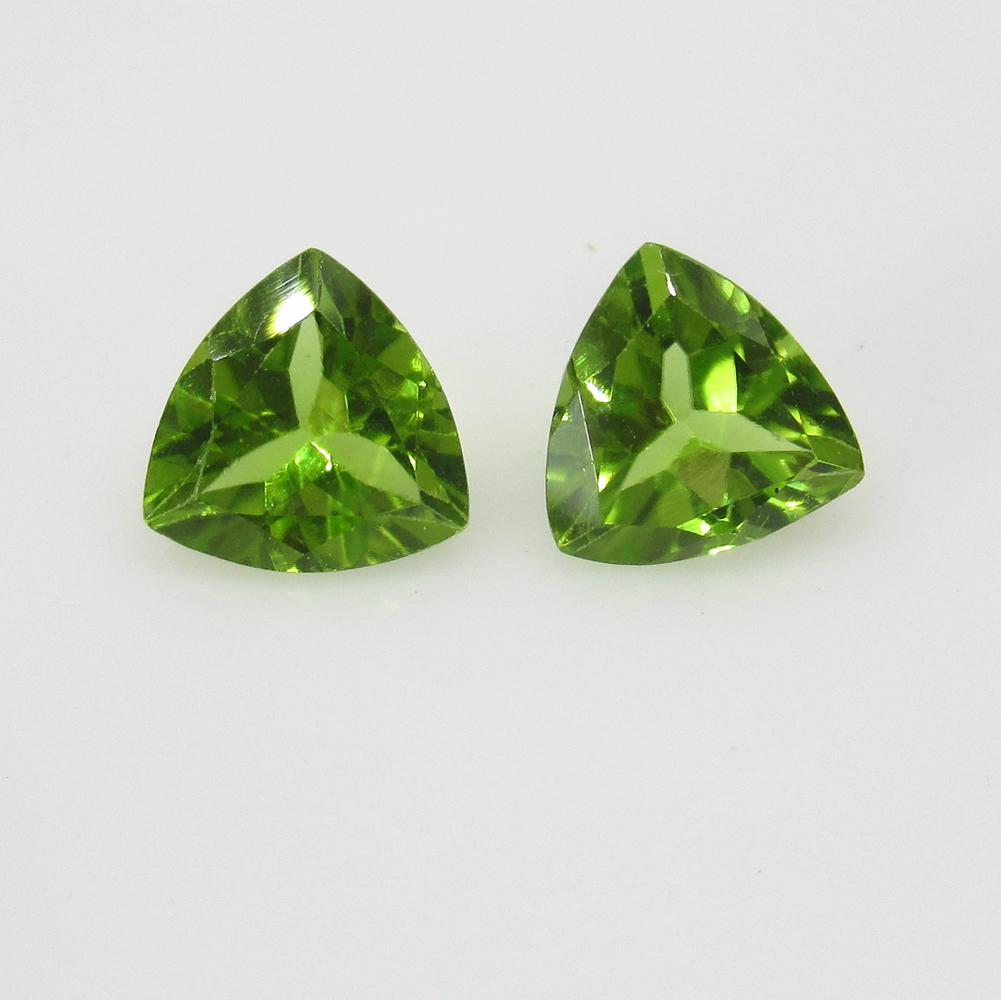 2.39 Ct Natural Pakistan Peridot Trillion Pair: No Reserve! Title: 2.39 Ct Natural Pakistan Peridot Trillion Pair Stone Clarity: VVS Gemstones: Natural Peridot Carat Weights: 2.39 Size/Dimensions: 7.30 x 7.20 x 4.00 mm / 2 PC's Additional Informati