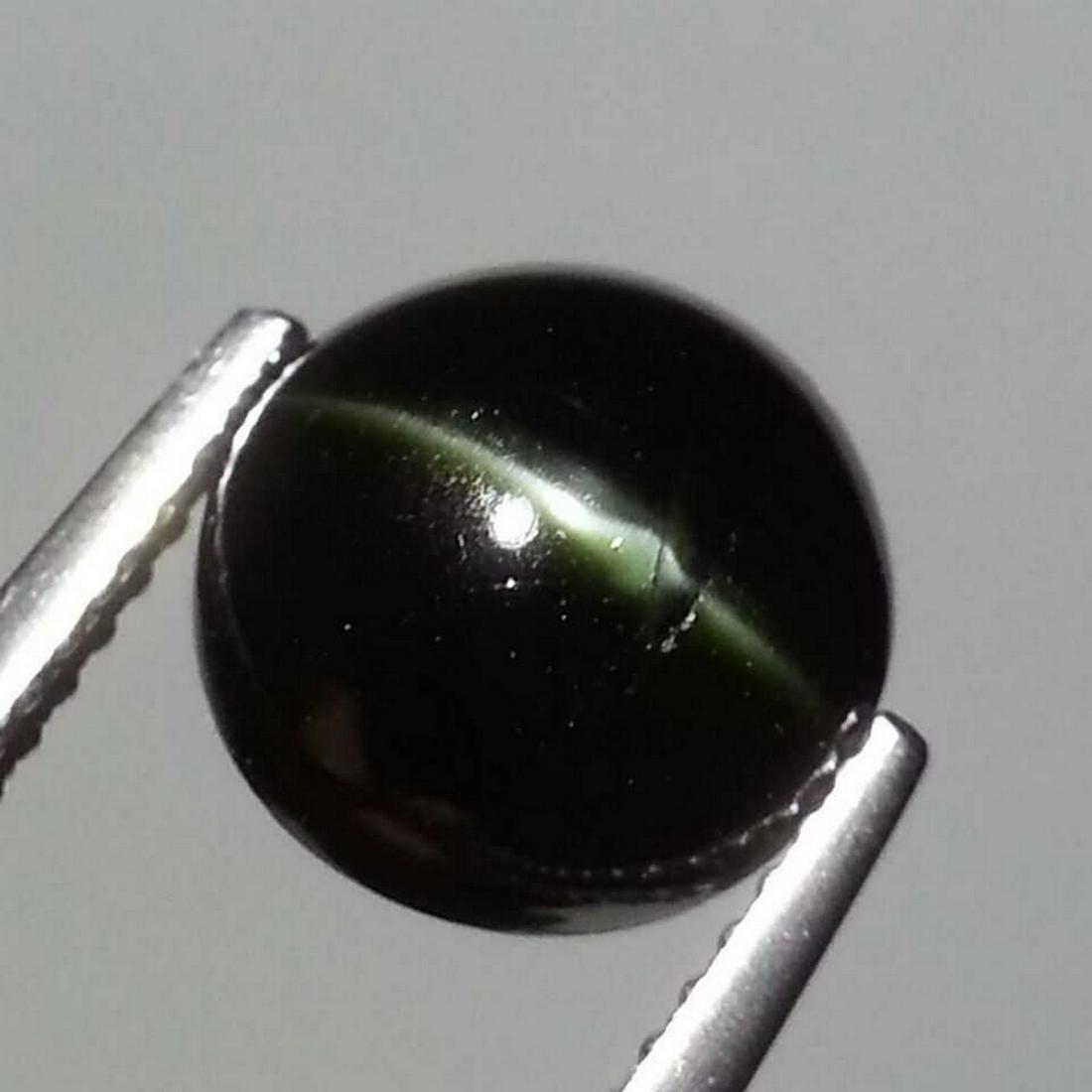 Natural Kornerupine Cat's Eye 3.99 ct: No Reserve! Title: Natural Kornerupine Cat's Eye 3.99 ct Color/Clarity: Opaque Gemstones: Loosegemstone Carat Weights: 3.99 Size/Dimensions: 9.20 x 9.20 x 5.30 Additional Information: Round - Srilanka