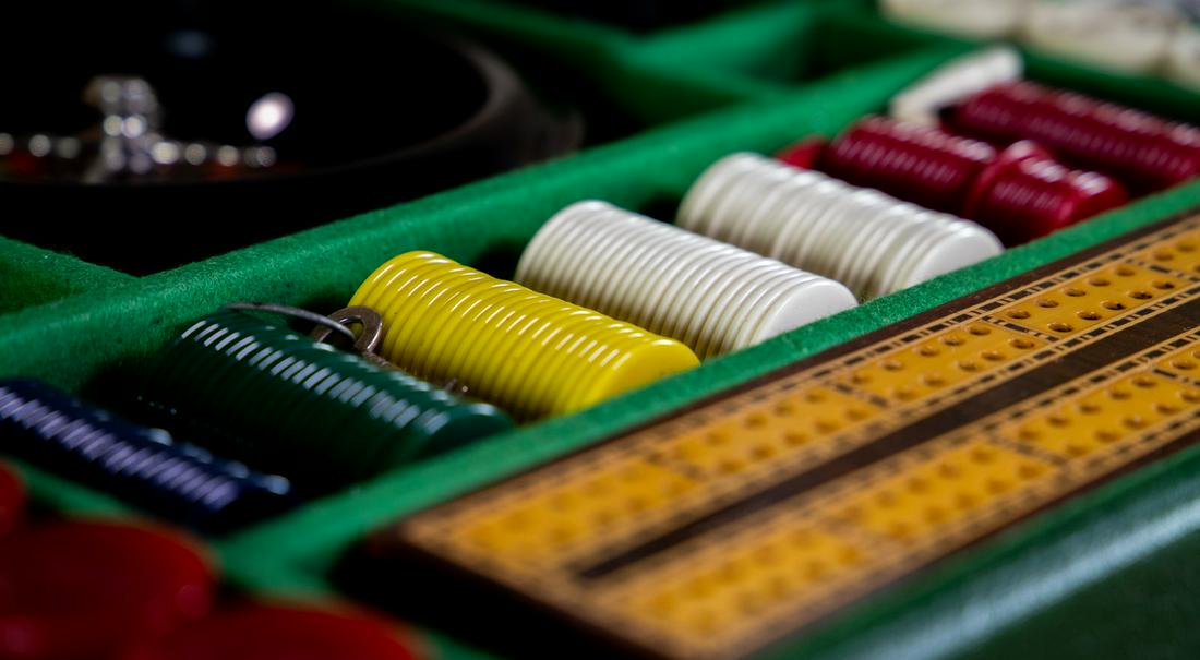 Suitcase Games Box c.1920: Title: Suitcase Games Box c.1920 Description A spectacular suitcase styled games box. Made from green leather in great condition. A larger item with a width of 50cm the interior comprises of many game