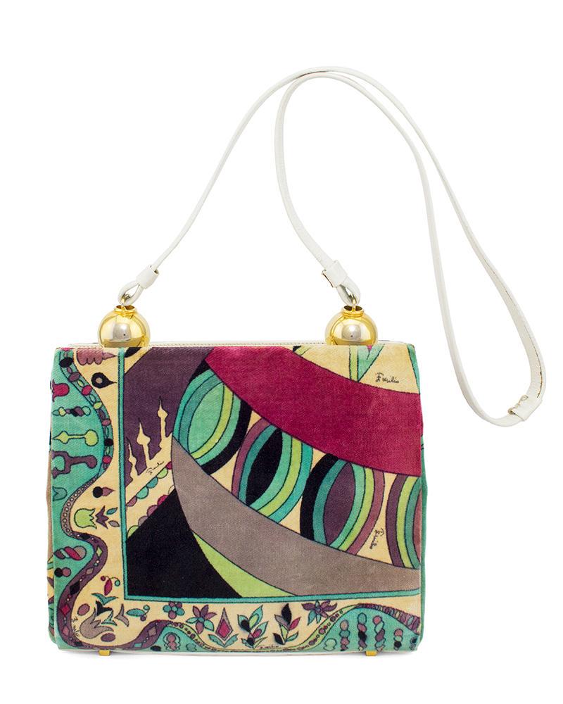 Emilio Pucci Velvet Printed Purse With White Leather: 1960s Emilio Pucci purple, black and blue printed velvet shoulder bag with gold ball accents and white leather trim. The purse has 3 white leather compartments; two open pockets on either side and a c