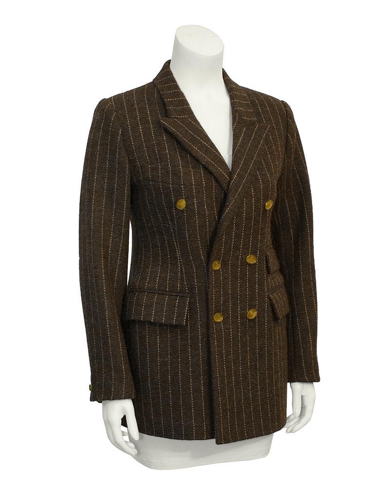 Vivienne Westwood Brown Wool Blazer: British punk designer Vivienne Westwood's wool blazer from the 1980's. Heavy weight brown wool, with beige pinstripes. Two flap pockets on right waist, one on the left waist and a slash breast pocket 