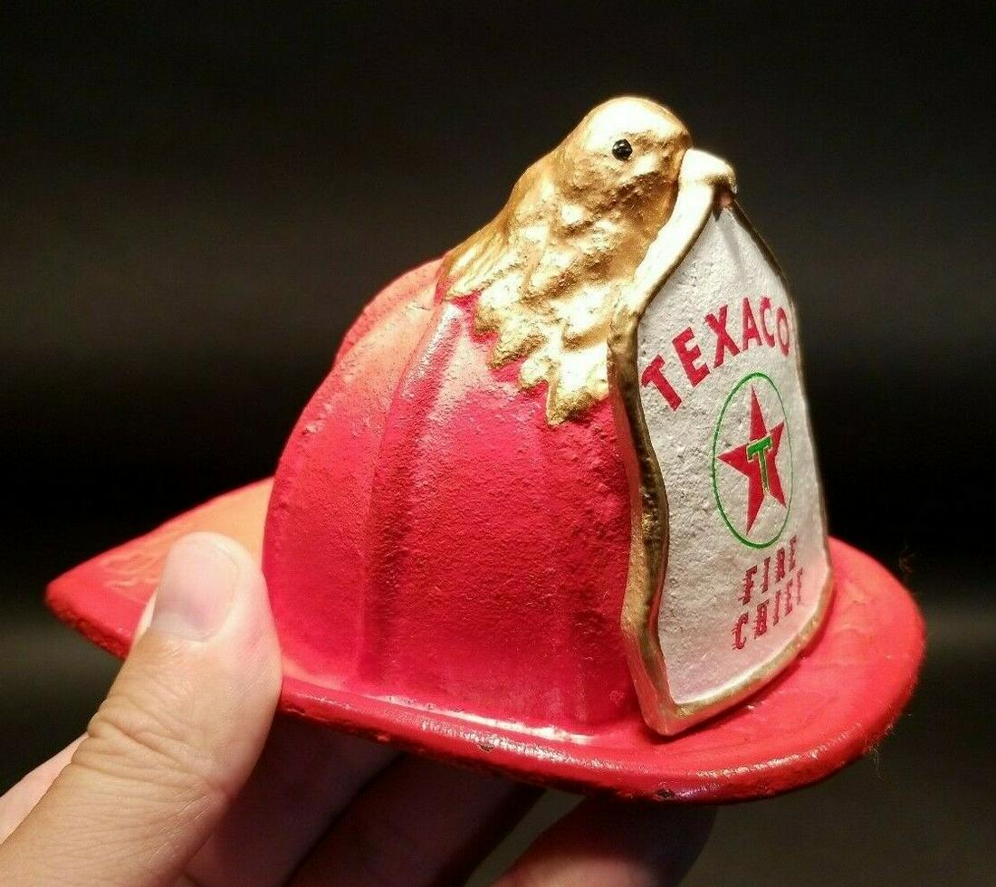 Miniature Cast Iron Texaco Fire Chief Helmet: 5 3/4" long x 4 1/2" wide 3 1/4" tall Antique Vintage Style Cast Iron Texaco Fire Helmet. Such a neat reproduction antique fire helmet. This wonderful red fire engine helmet was cast from an antique a