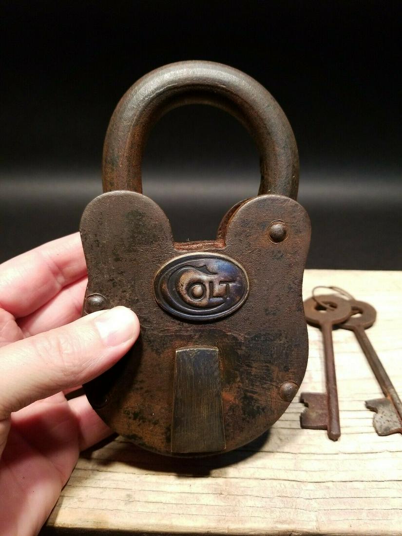 Cast Iron Colt Firearms Ammo Box Padlock Lock & Key: 6 1/2" tall x 3 3/4" Wide Nice reproduction cast iron Colt padlock! This lock is fully functional! Hard to tell its age. Heavy iron and brass. Great aged patina throughout. Limited quantity available!