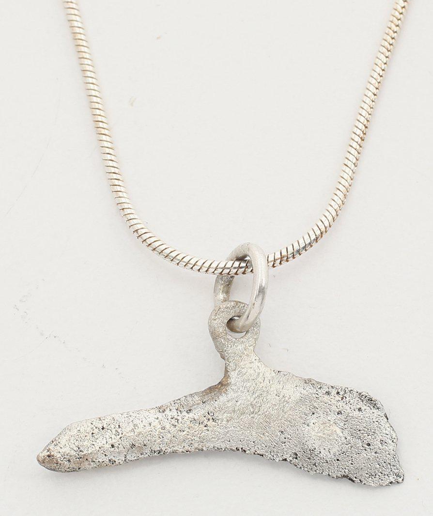 GREEK BRONZE DOLPHIN “COIN” PEDANT 5TH-4TH CENTURY BC: From the Greek Black Sea colony of Olbia which provided slaves, cereal and fish. Before die struck coinage, these dolphin figures served as a means of exchange, vital for commerce to thrive. They are