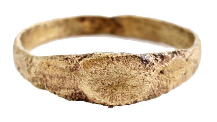 MEDIEVAL EUROPEAN RING, 7-10 C. AD JEWELRY: Viking period. Gilt bronze size 5 ¼ with 2.6mm band flaring to the shoulders. Small oval bezel with slightly depressed center. Surface textured from burial. . Professionally refurbished with the 24ka