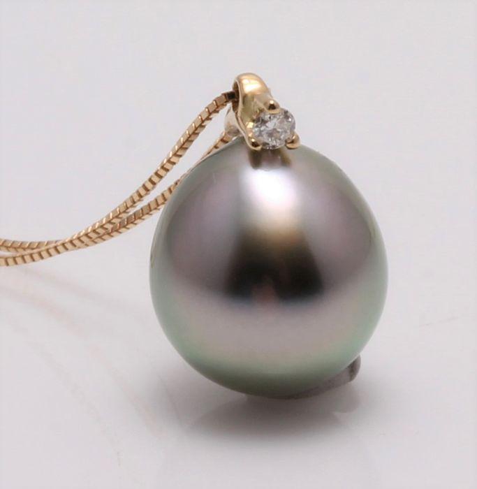 18 kt. Yellow Gold - 8x9mm Peacock Tahitian Pearl Drop: Produced in the tropical lagoons of French Polynesia, this pearl has been selected for its natural special silvery green body colour with shimmering purple hues. The yellow gold and diamond enhance th
