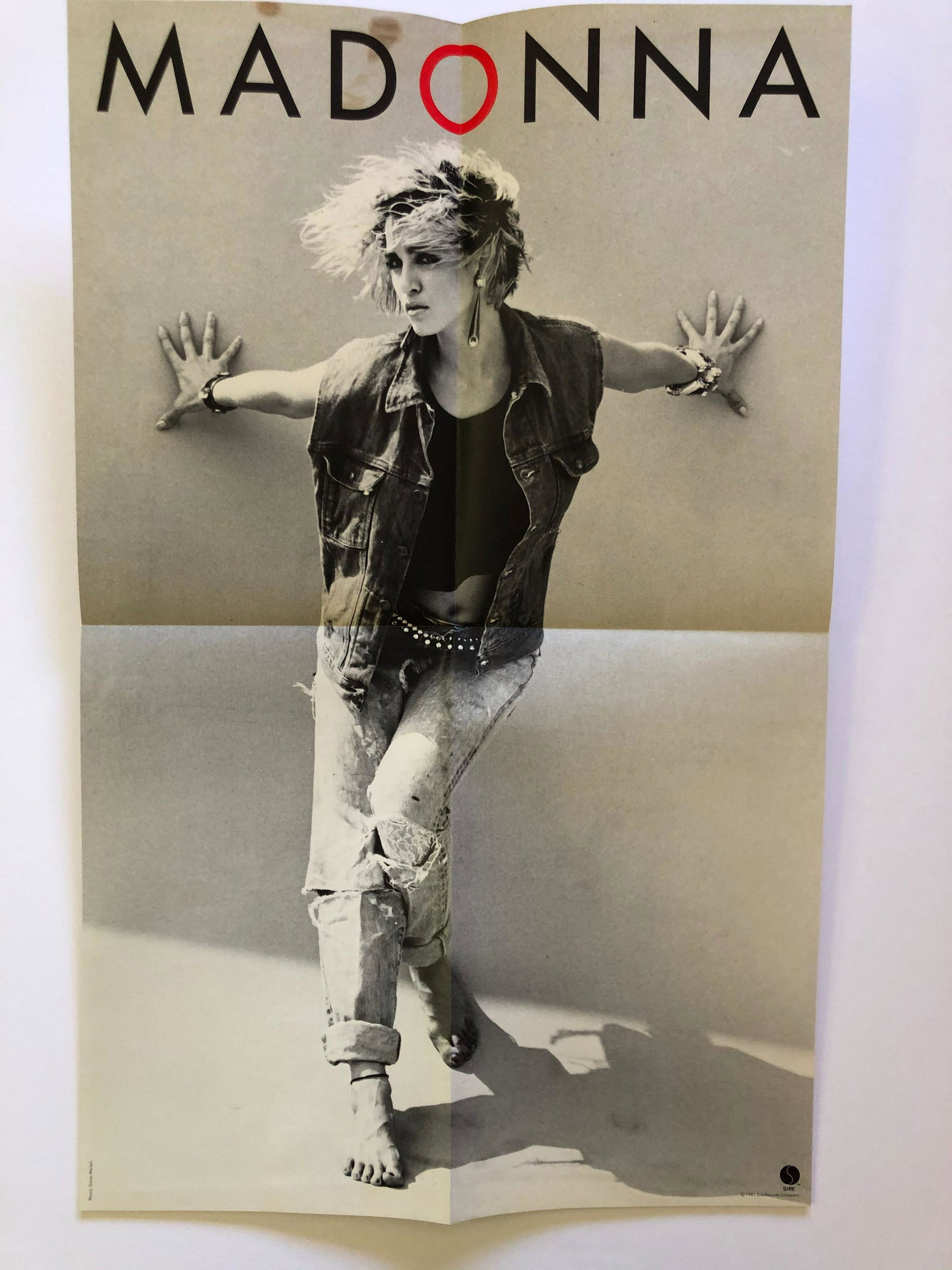 Rare 1983 Madonna Poster: Rare 1983 Madonna Poster with photo by Steve Meisel. Poster has small brown mark at top boarder. First release of her album on Sire records. Reserve: $20.00 Shipping: Domestic: Flat-rate of $12.69 to 
