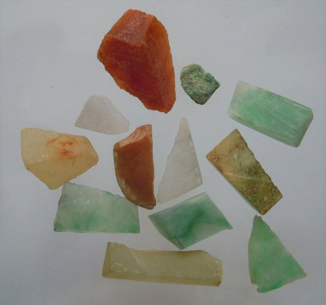 28.45 CT SET OF 12 GENUINE BURMESE JADEITE JADE: No Reserve! Title: 28.45 CT SET OF 12 GENUINE BURMESE JADEITE JADE Origin: Hpakant, Kachin State, Myanmar Size: 0.5-1.7 cm / 5.69 gram Description: set of 12 green, brown and colorless bits and slices