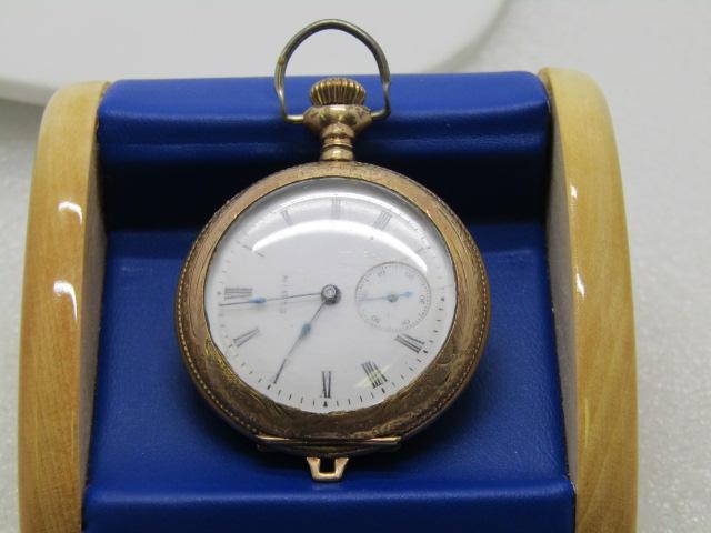Vintage Elgin Hunter: Vintage Elgin's Hunter's Pocket Watch, 10kt G.F., with second hand. Works. It is 2" long from stem to bottom and 1.5" wide. I do not know the year for certain but it is early 1900's. The back does not