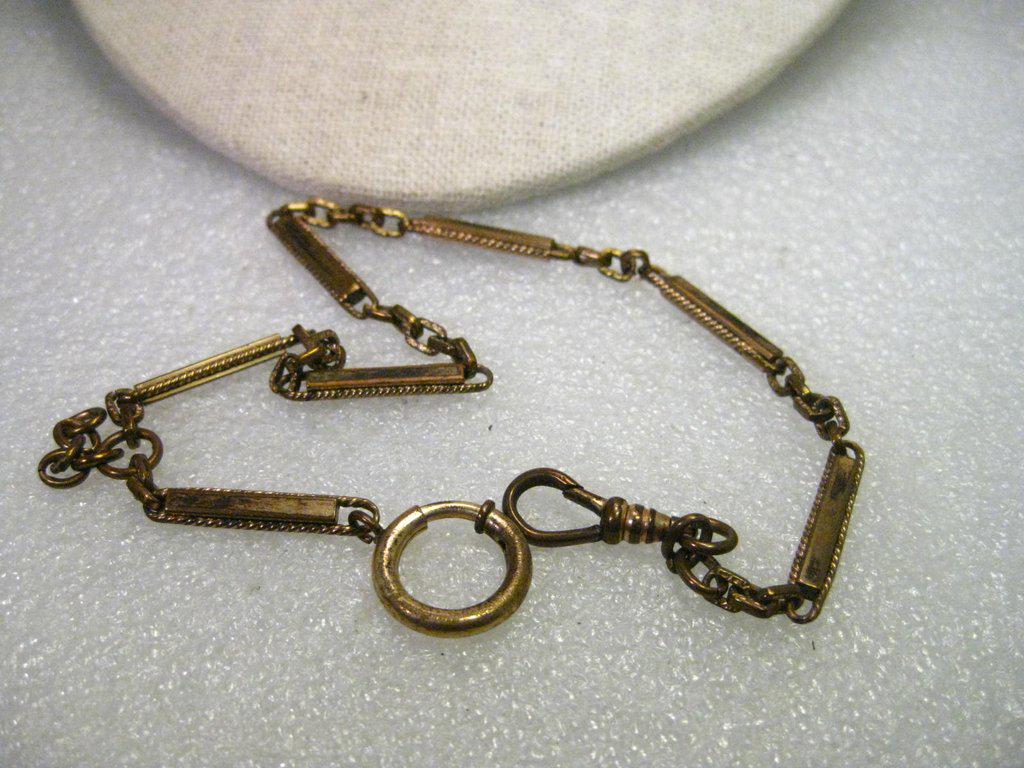 True Vintage Early 1900's Watch Chain, Gold Filled, 13": Vintage Early 1900's Watch Chain, Gold Filled, this is 13" long with a large spring ring that is definitely vintage styled. There are 7 links that are approximately 1" each with connector flat texture