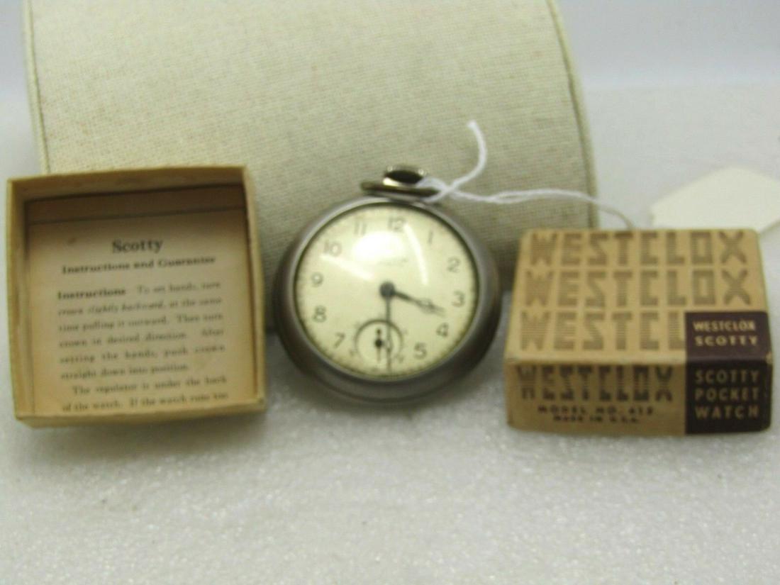 Vintage Westclox Scotty Pocket Watch, Second Dial,: Vintage Westclox Scotty Pocket Watch, with original box and insert instruction card. Works. This has a second hand dial as well. It is 55.from the pin on top to the base of the watch and it is 50.3mm