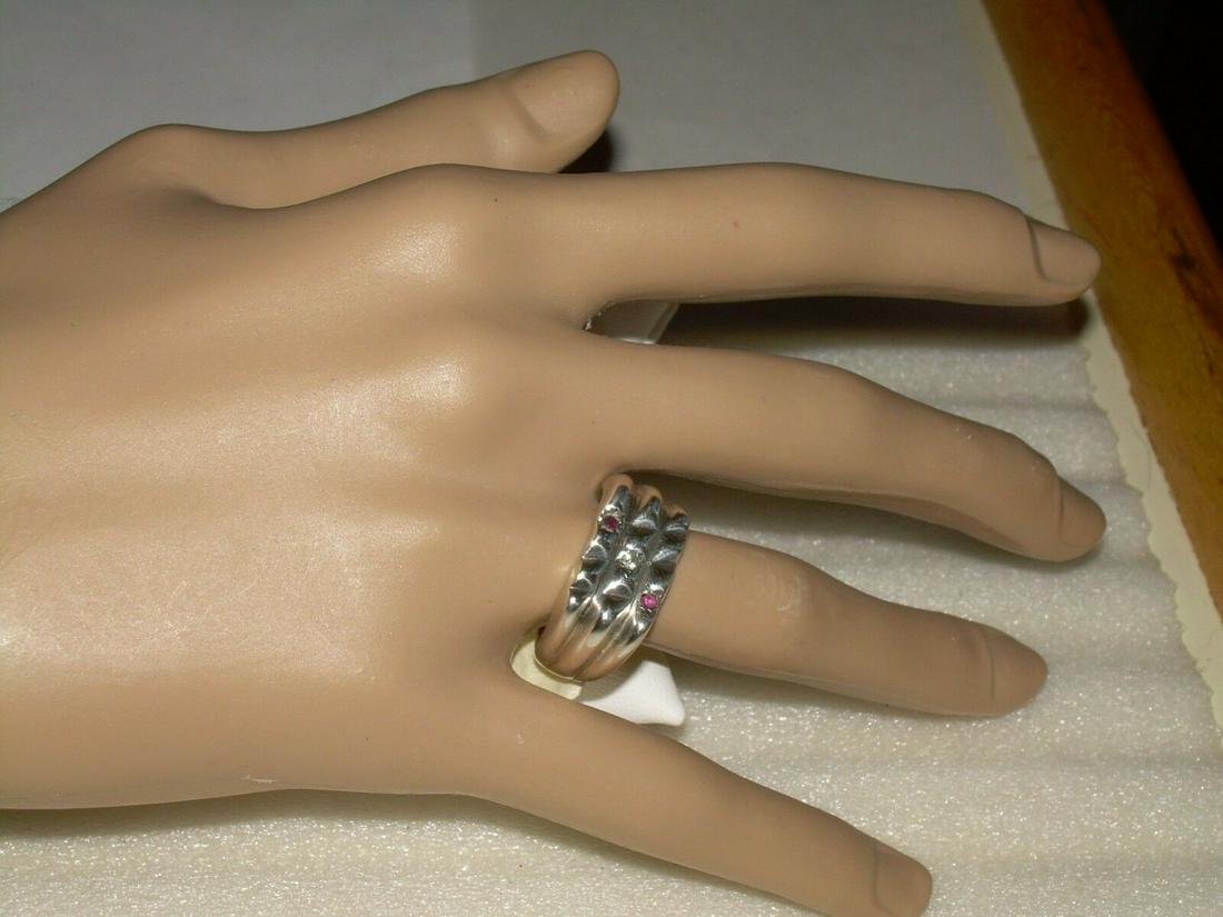 Vintage Sterling Silver Unisex Ring W/Diamond, Ruby,: Vintage sterling silver unisex ring is 3 tiered. The top tier has a garnet stone, middle has a diamond, and the bottom has a ruby. The ring weighs 9.89 grams. It is signed 35 UL and also has a mark of