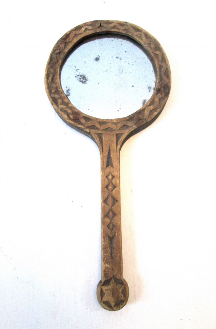 Carved Shard Mirror: Title: Carved Shard Mirror Date/Period: C 1820-50 Material: Basswood Dimension: 11”H X 5”W X 9/16”D Provenance: Great carved lollipop form hand mirror. Cleverly made, two piece construction, all