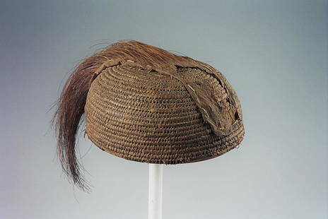 Tamberma Helmet And Slath: Title: Tamberma Helmet And SlathDate/Period: XXth centuryMaterials: Raphia, lion's tail and ironDimension: 7" 4/8 and 24" 6/8Description: yikir raphia helmet from the Tamberma people of Northern