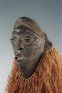Lulua Mask: Title: Lulua MaskDate/Period: XXth centuryMaterials: Wood, raphiaDimension: 11"Description: Lulua makisi mask from Southern Kasai (D.R. Congo). These masks were used during the mukanda initiation