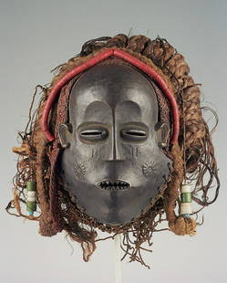 Important Songo Mask: Title: Important Songo MaskDate/Period: XXth centuryMaterials: Wood, raphia, glass beadsDimension: 9" 7/8Description: Songo mwana pwo mask of the beautiful young woman (Central Angola). This mask was