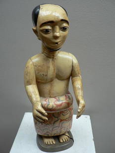 Ewe Figure: Title: Ewe FigureDate/Period: XXth centuryMaterials: Wood, European paintDimension: 15* 3/8Description: Altar figure of the voodo cult, represeting a priest in colourful loin cloth. From the Ewe