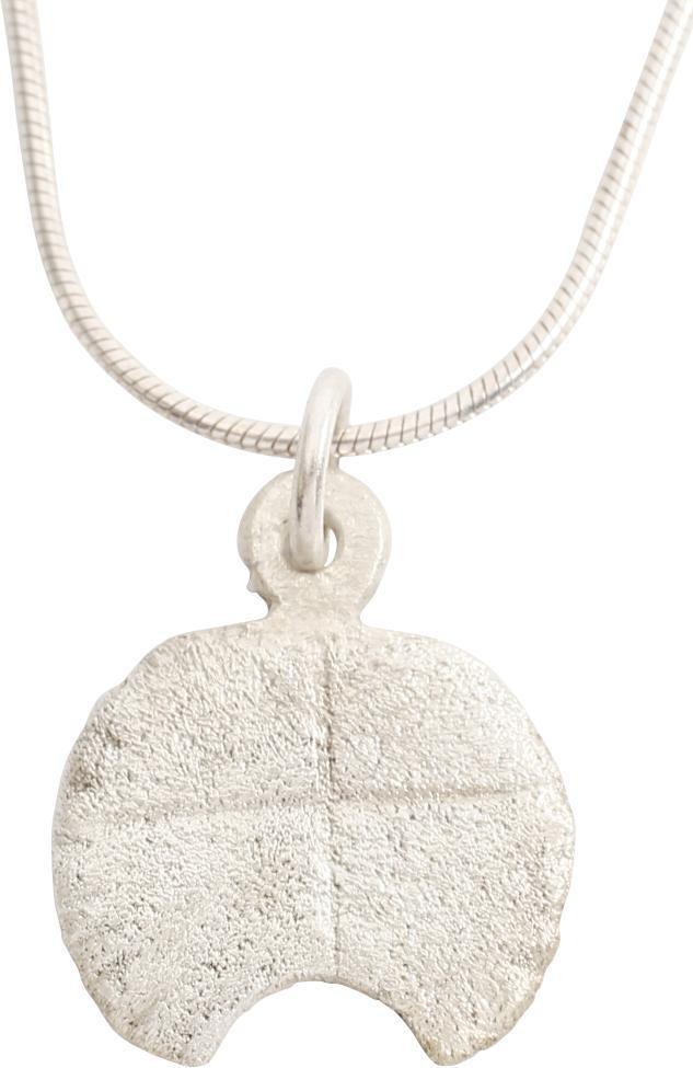 VIKING LUNAR PENDANT, 11TH-12TH CENTURY.: Period of transition into Christianity. Over ¾Â” height, as a very full crescent moon with simple cross scribed on the front. Made by the opened mold process. The period of conversion to Christian