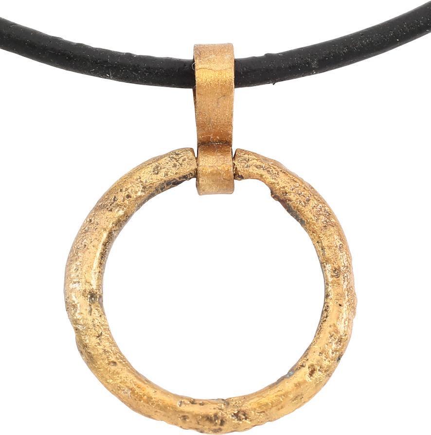 VIKING PROTECTIVE BROOCH PENDANT 10th CENTURY.: Circular bronze, Just under 7/8Â” diameter with rounded front and flat back forming a ridged edge. The surface with light texture from burial. Professionally conserved and the gold surface restored
