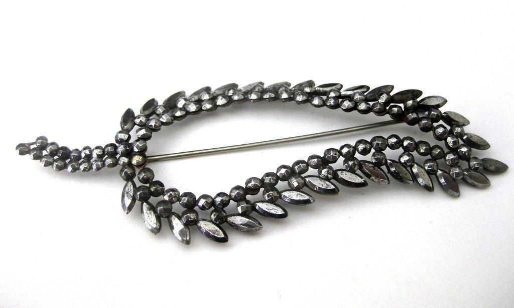 Antique Victorian Large Cut Steel Leaf Pin: Title: Antique Victorian Large Cut Steel Leaf Pin Additional Information: Cut Steel Leaf Pin Circa. 1900 British Wonderful cut steel pin. Large and in perfect condition. Measures 4 1/2 inches wide x 1