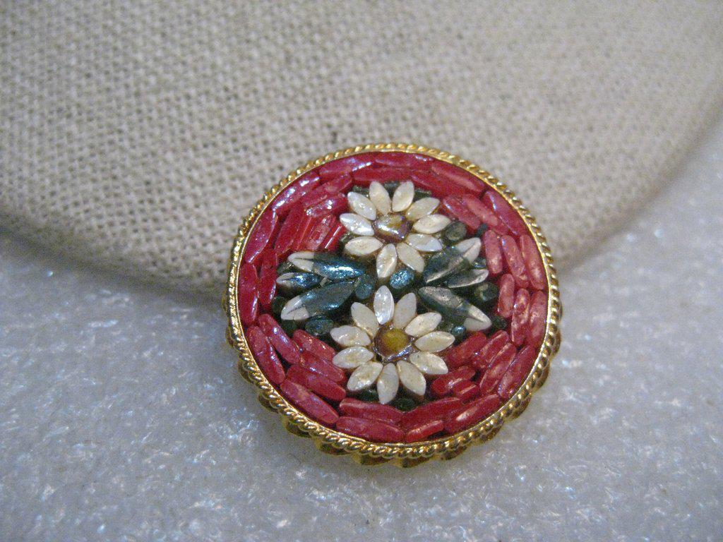 Vintage Floral Micro Mosaic Brooch, Daisies, Red and: Vintage Floral Micro Mosaic Brooch - two daisies in white and yellow with green leaves and a background of red mosaic pieces. It is inlaid in a gold tone setting. It is signed Made in Italy on the bac
