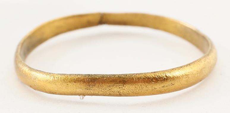 VIKING WOMAN’S WEDDING RING, 10-11 CENTURY AD SIZE 6: Low rounded band, 2 .1mm width. Surface textured from burial. Professionally refurbished with the surface restored in 24 karat gold. Gift boxed with certificate of authenticity. Reserve: $55.00 Shippi