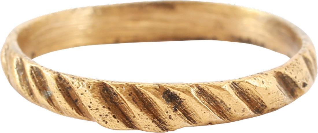 RARE VIKING RIBBED WEDDING RING 10th CENTURY: Gilt bronze, size 6 ½, Broad band, 2.6mm, flat with rounded edges. Probably cast with a core as the inside shows distinct tool finishing. The face hand cut in two ranks of notches, one near transvers