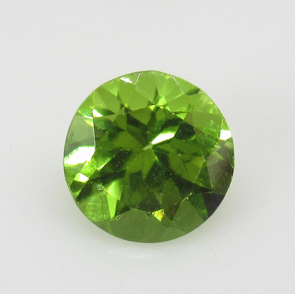 1.29 Ctw Natural Pakistan Peridot Round Cut: No Reserve! Title: 1.29 Ctw Natural Pakistan Peridot Round Cut Stone Clarity: VVS Gemstones: Peridot Carat Weights: 1.29 Size/Dimensions: 7.00 x 7.00 x 4.50 mm Additional Information: Top Class Luster