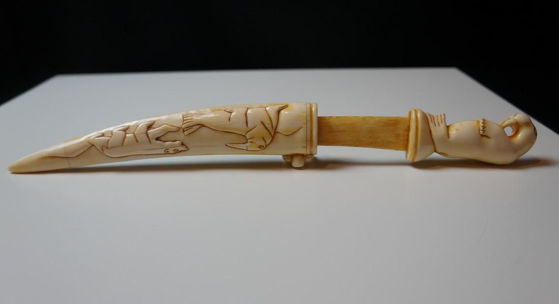 Antique Siberian YUPIK Knife, INUIT Scrimshaw: Title: Antique Siberian YUPIK Knife, INUIT Scrimshaw Date/Period: Early to mid 20th century Origin: Ulelen Village, Siberia Material: Tusk Dimension: With the knife inserted in the sheath: 12.8 Inches