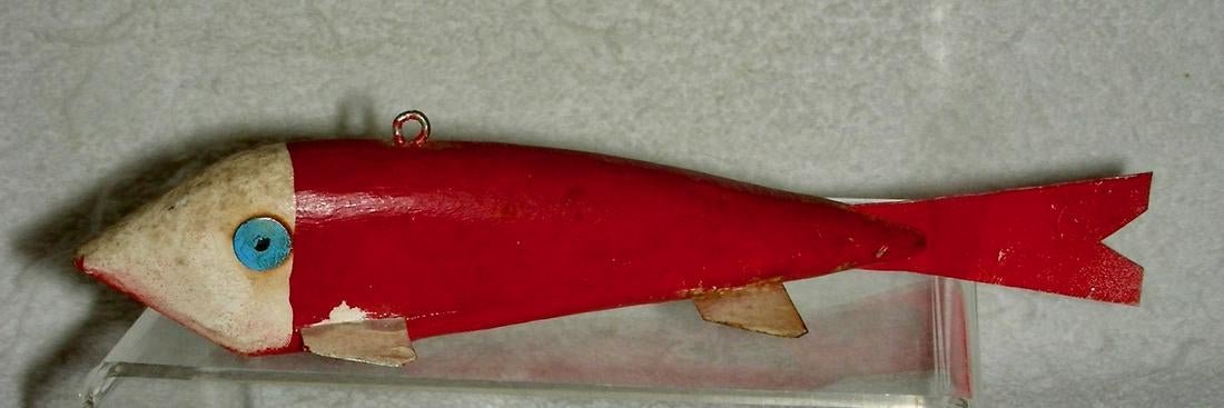 Red & White Painted Fishing Lure Decoy: Title: Red & White Painted Fishing Lure Decoy Provenance/Additional Info: A 20th century fishing lure or decoy with red & white painted surface, bright blue tack eyes and tin fins and tail. It is 8”