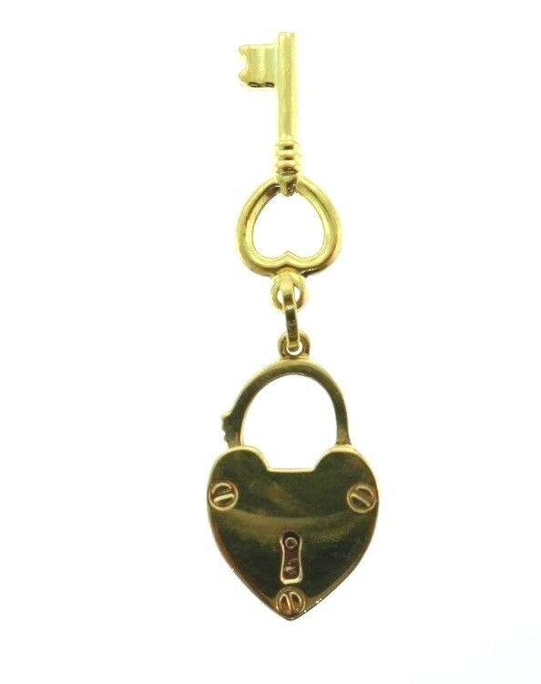 14k Yellow Gold Lock Key Charm: NS UT0 Lovely Italian 14k yellow gold lock and a key charm Stamped with a maker's mark, a hallmark for 14k and a country of origin (Italy) Measurements: the heart is 1 1/8" H (with a bail) x 1/2" W, t