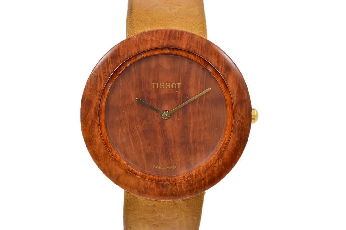 Vintage Tissot Wood Watch W151 Midsize Quartz Watch: Title: Vintage Tissot Wood Watch W151 Midsize Quartz Watch Brand: Tissot Date: 1980's Model: W151 Movement: Quartz Functions: Time Case Metal: Wood and steel case Case Size: 38mm X 38mm Diamonds: N/A