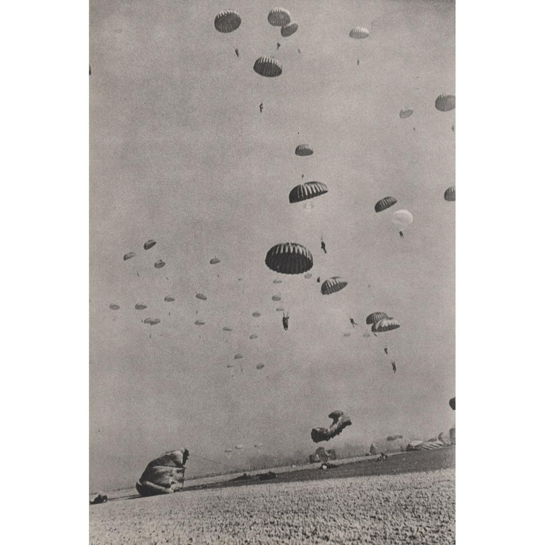 ROBERT CAPA - U.S. 1st Airborne Paratroopers: Artist: ROBERT CAPA Print Title: U.S. 1st Airborne Division, Germany, March 24, 1945 Medium: Sheet-fed Gravure Printing Date: 1950's Printed in Japan Image Size approx: 8.25 x 5.5 inches Robert Capa (