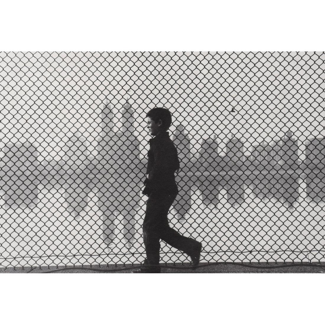 RUTH ORKIN - Passing by the Central Park Reservoir: Artist: RUTH ORKIN Print Title: Passing by the Central Park Reservoir Medium: Sheet-fed Gravure Printing Date: 1980's Printed in the USA Image Size approx: 6.25 X 9 inches Ruth Orkin (1921-1985) was a